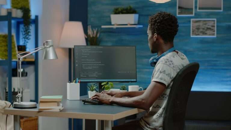 Programmer using binary code for website interface development on computer. person coding system for cybersecurity with firewall data. coder programming security for software app