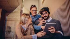 Scrolling through their social media feeds Scrolling through their social media feeds