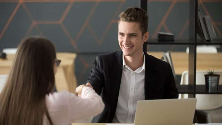 Smiling hr employer handshaking successful job applicant hiring or greeting