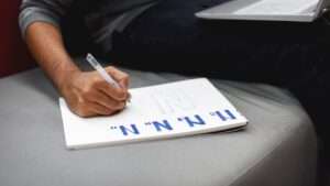 Startup Business People Writing on Notebook Startup Business People Writing on Notebook